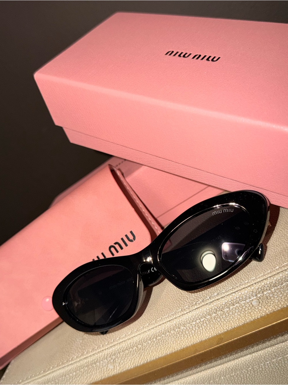 Miu Miu Black Oval Women's Sunglasses with Dark Lenses